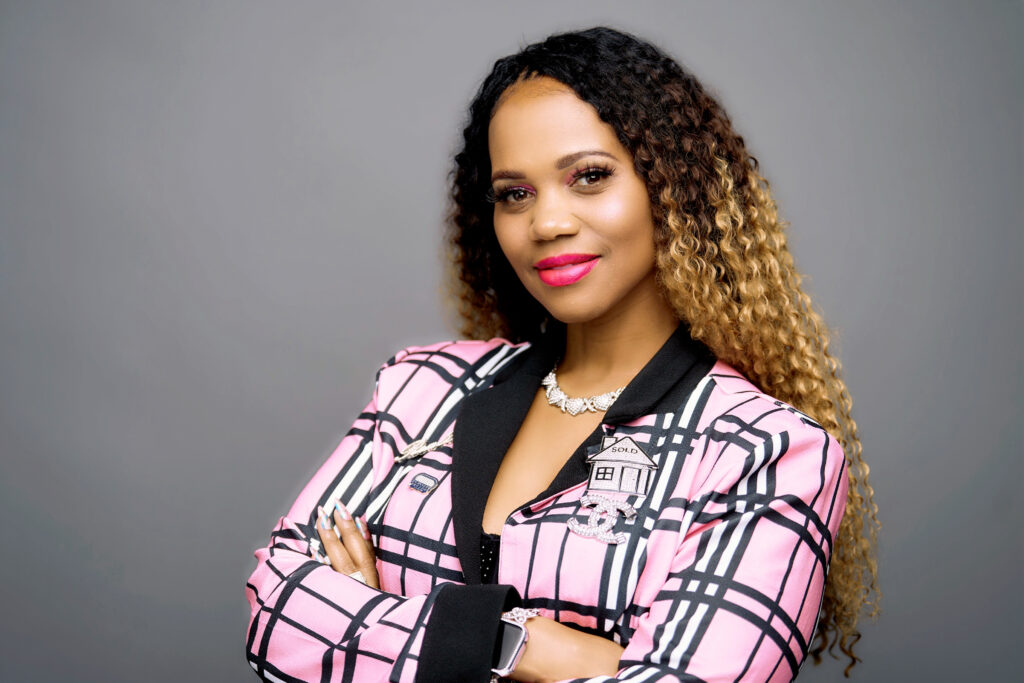 Tesha Perry in a pink plaid blazer