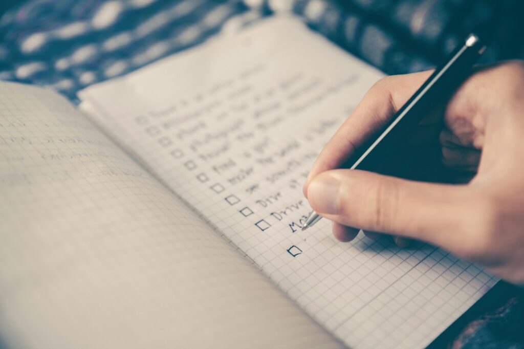 Notebook checklist with a pen on a desk